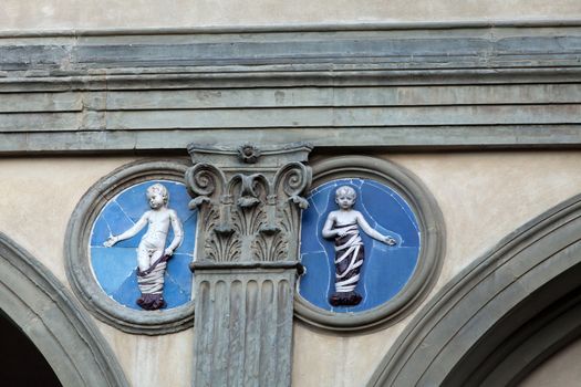 Piazza della Santissima Annunziata in Florence. Ospedale degli Innocenti. Ceramic  tondo by Andrea della Robbia 