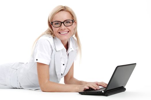 business woman lies and working on laptop