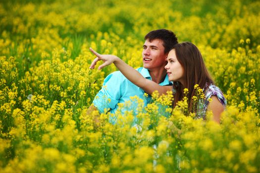 lovers hug on yellow flower field