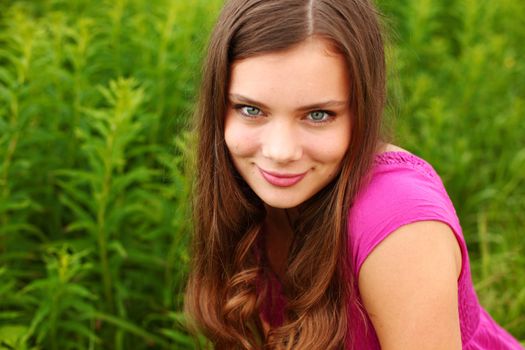 woman in grass close up