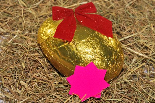 Easter egg with golden bow