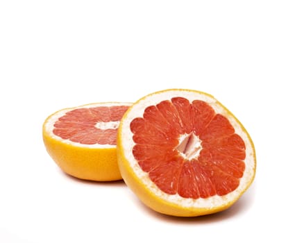Grapefruit with slices on a white background.