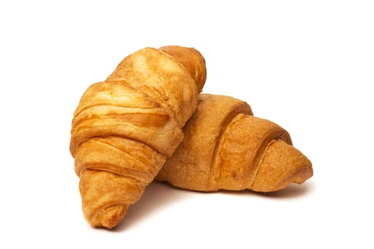 two croissants isolated on white background