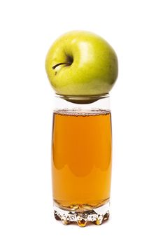 glass of apple juice and apples isolated on white