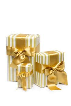 Gold gift boxes isolated on white background