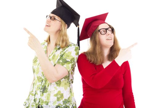 Two happy female graduates