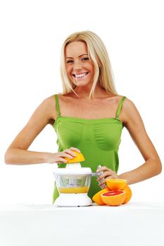 woman squeezes juice by juicer