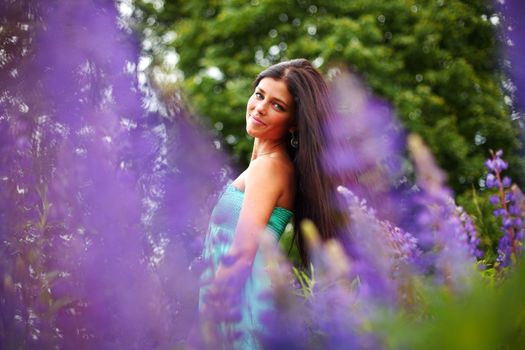 woman on pink flower field close portrait