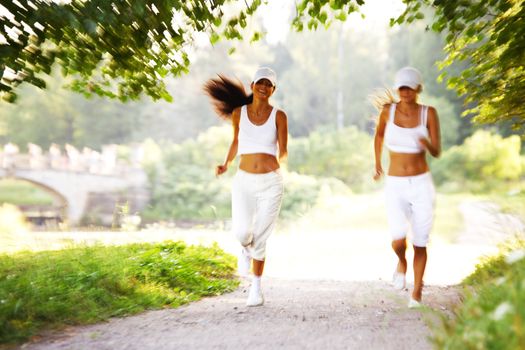 women run by sunny park alley