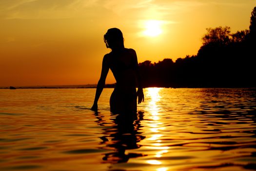 ocean woman in sunrise light