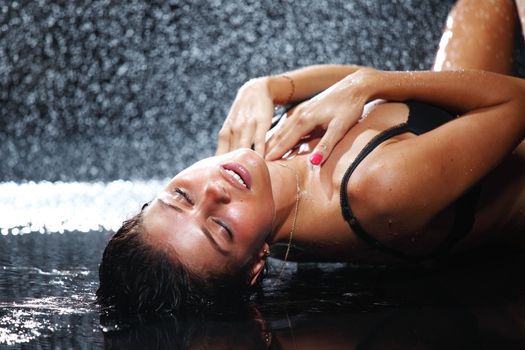 sexy woman in water studio