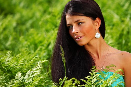 woman on flower field close portrait