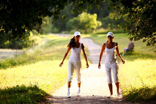 women run by sunny park alley