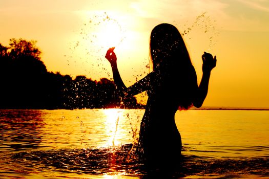ocean woman in sunrise light