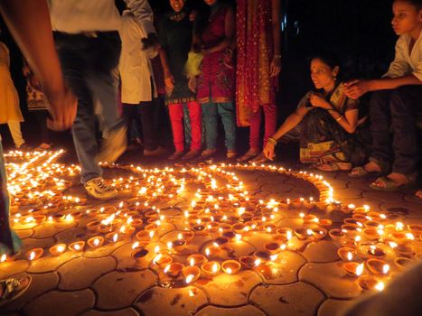 People from India light up traditional earthen lamps on the occassion of Diwali festival celebrations.                              