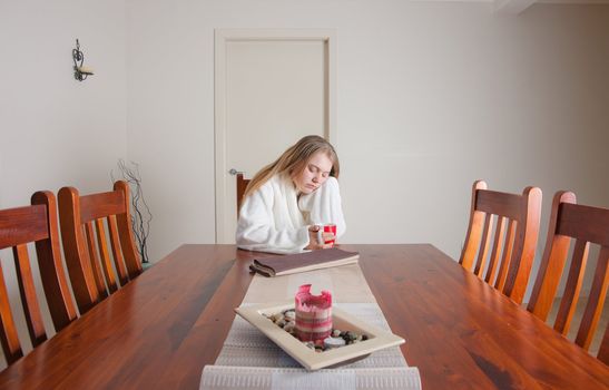 young woman having coffee in the morning