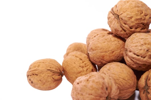 Bunch of ripe walnuts isolated on white background