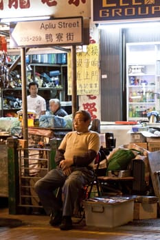 HONG KONG - FEB 16, A Chinese hawker in Apliu Street, Hong Kong on 16 February, 2012. It is one of the feature in old Hong Kong. 