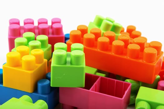 Plastic building blocks on a white background