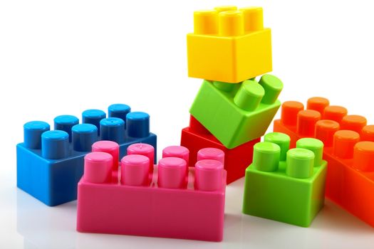 Plastic building blocks on a white background