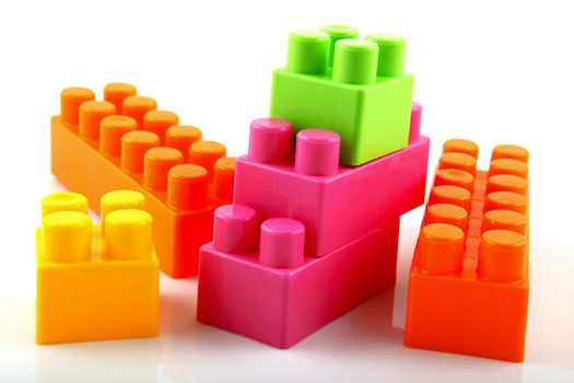 Plastic building blocks on a white background