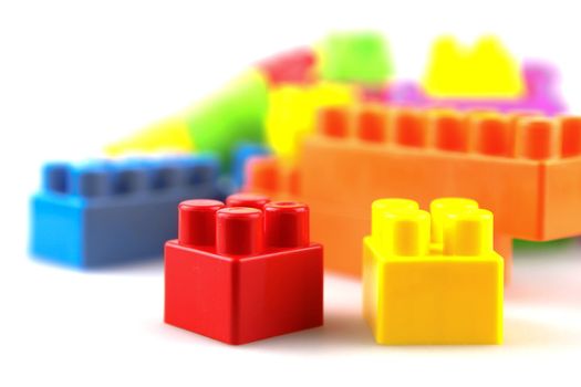 Plastic building blocks on a white background