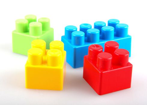Plastic building blocks on a white background