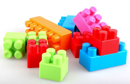 Plastic building blocks on a white background
