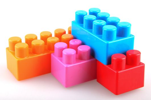 Plastic building blocks on a white background