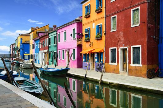 Colorful buildings in Burano island sunny street, Venise, Italy