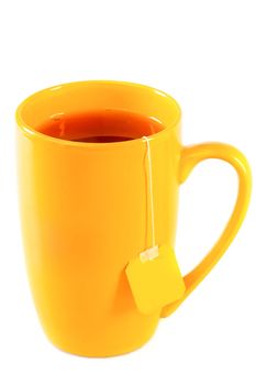 Yellow tall mug of tea with a label of packaged tea