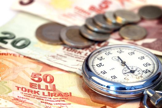 Chronometer and turkish liras bills, close up , shallow dof