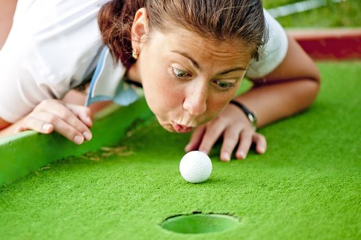 Girl cheating in the game of golf