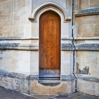 A medieval wooden door in a church wall in England
