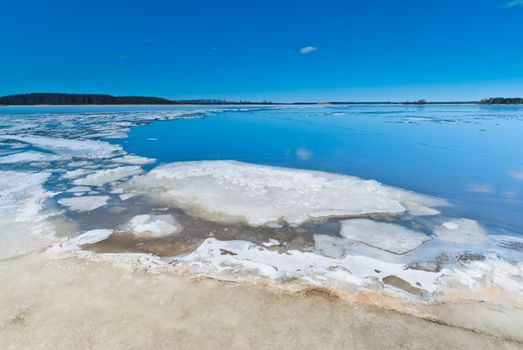 Melting ice on the lake during the ice drift.