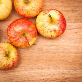 Freshly harvested apples on a wooden table