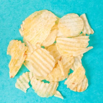 Crinkle cut potato chips on a vibrant background