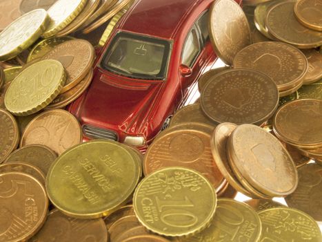 car under a pile of coins