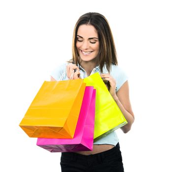 portrait young adult girl with colored bags