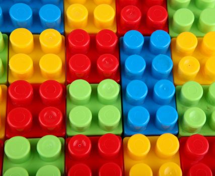 Plastic building blocks on a white background