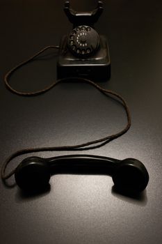 an old vintage telephone in dramatic lighting.