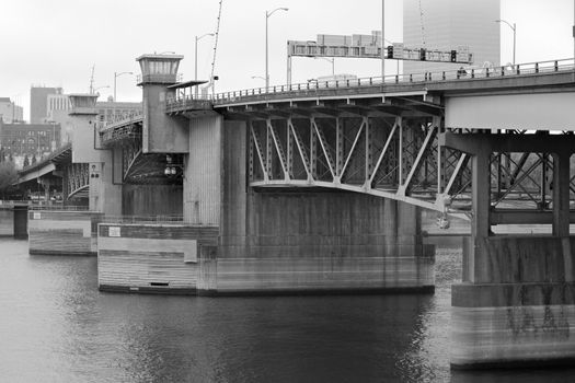 Portland's Burnside bridge over the Williamette River on a hazy day in black and white