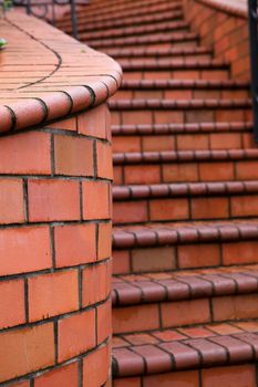 Home Red Tile Staircase that diminishes to soft focus