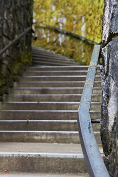 Concrete and stone stairway to a curve that is out of focus