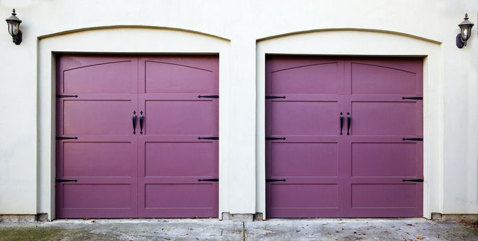 Two violet, purple, amethyst, or lavendar garage doors