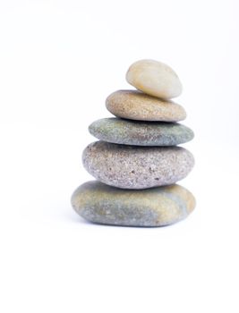 Water rounded stones stacked one by one. Can be used for business metaphor.