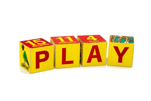Word "PLAY" made of children's cubes. Studio shooting.