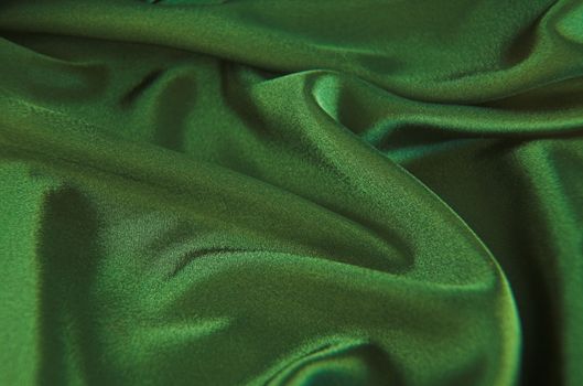 A background of green satin