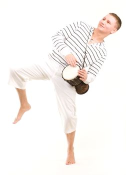Dancing boy with tambourine on a white isolated backoground