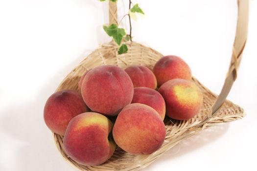 A basket of delicious, succulent peaches